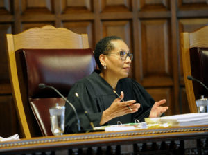 Sheila Abdus-Salaam, Associate Judge of the Court of Appeals, listens to oral arguments on whether criminal defendants should be allowed to use allegations made in civil rights lawsuits against police witnesses to question their credibility during cross-examination at the Court of Appeals on Wednesday, June 1, 2016, in Albany, N.Y. (AP Photo/Hans Pennink)