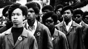 Members of the Black Panthers line up at a rally at DeFremery Park in Oakland, Calif.
