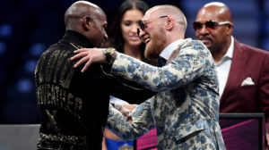 LAS VEGAS, NV - AUGUST 26: (L-R) Floyd Mayweather Jr. and Conor McGregor shake hands after Mayweather's 10th round TKO victory in their super welterweight boxing match on August 26, 2017 at T-Mobile Arena in Las Vegas, Nevada. (Photo by Ethan Miller/Getty Images)